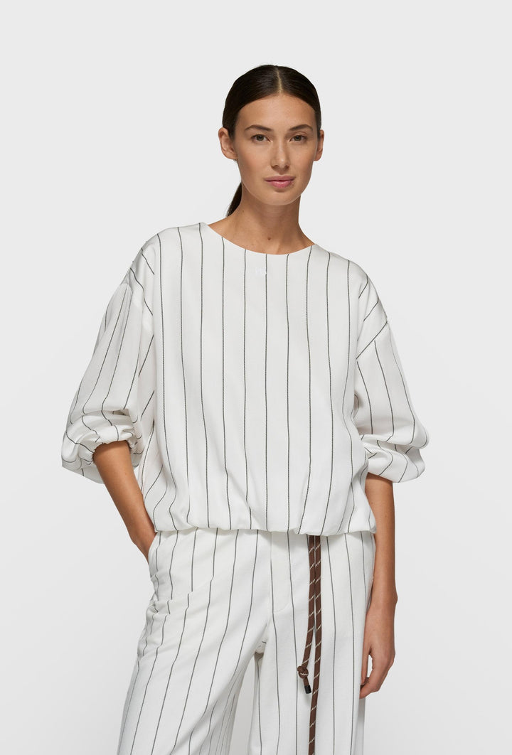 Kremowa bluzka w pionowy prążek z bufowanymi rękawami