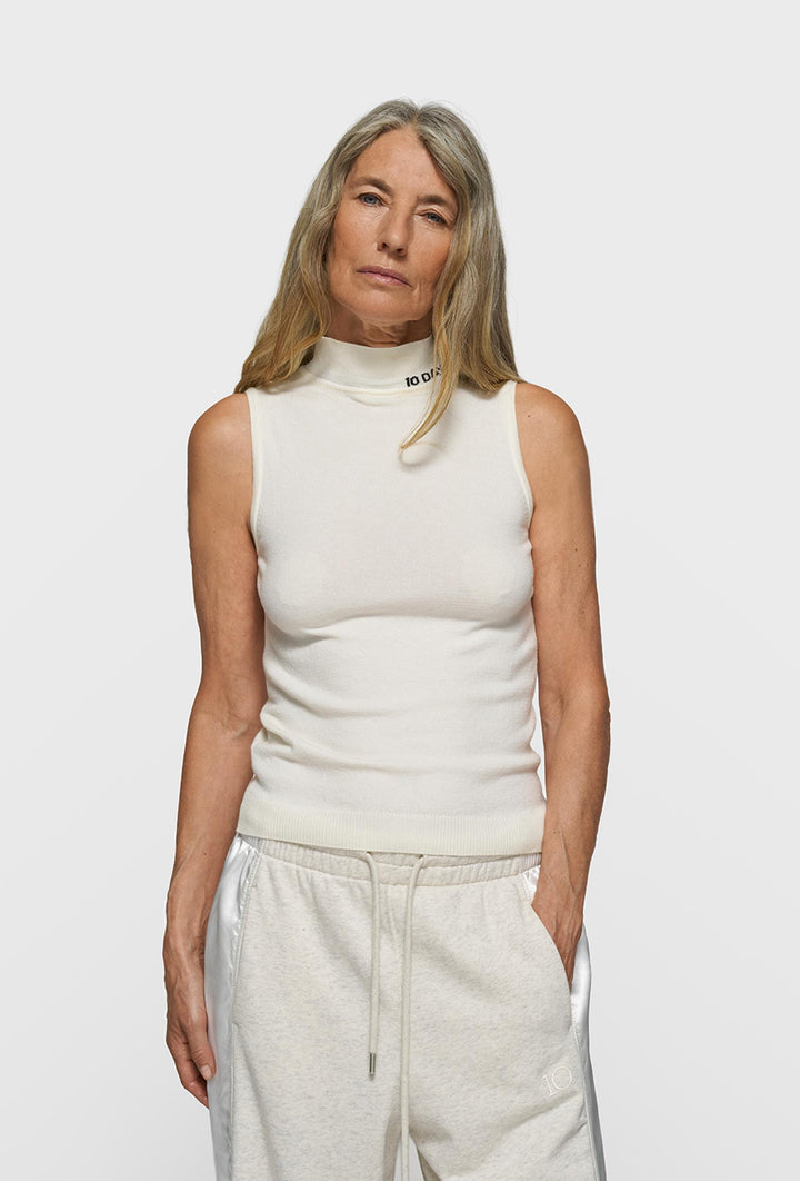 Kremowy bezrękawnik z golfem i logo 10DAYS