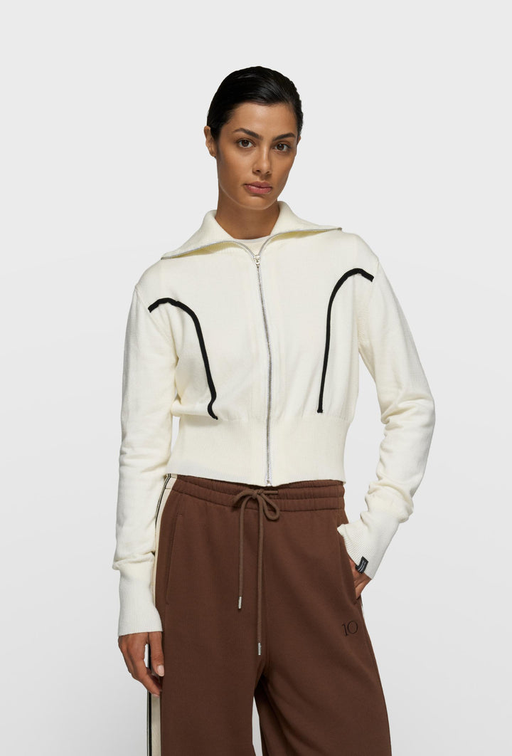 Krótki kardigan dresowy z kontrastowymi przeszyciami  w kolorze ecru