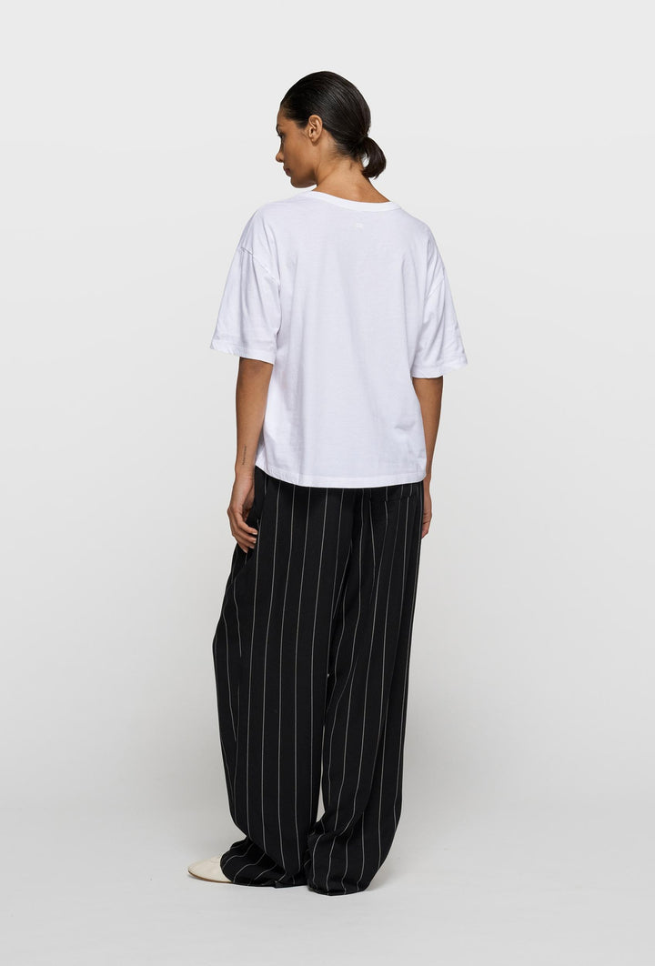 Bawełniany T-shirt oversize z metalicznym nadrukiem