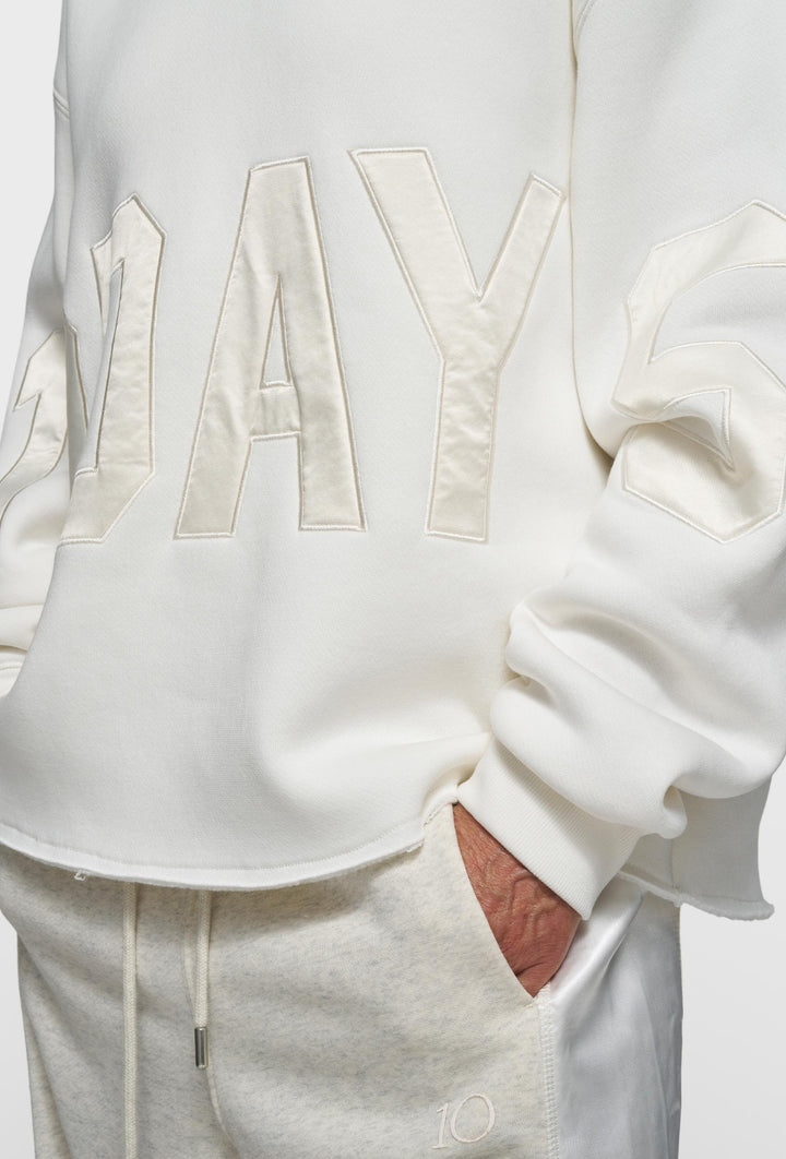 Kremowa bluza z kapturem z aplikacją „10DAYS”