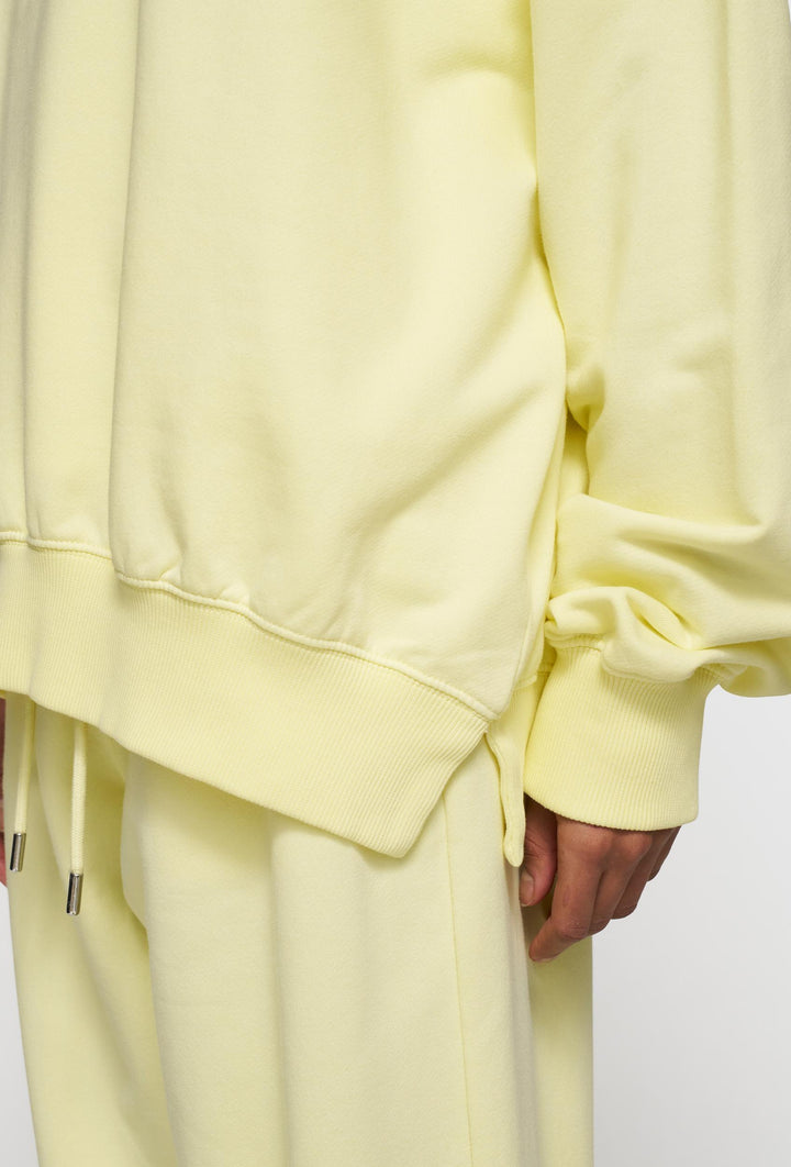 Nierozpinana bluza w pastelowym żółtym kolorze