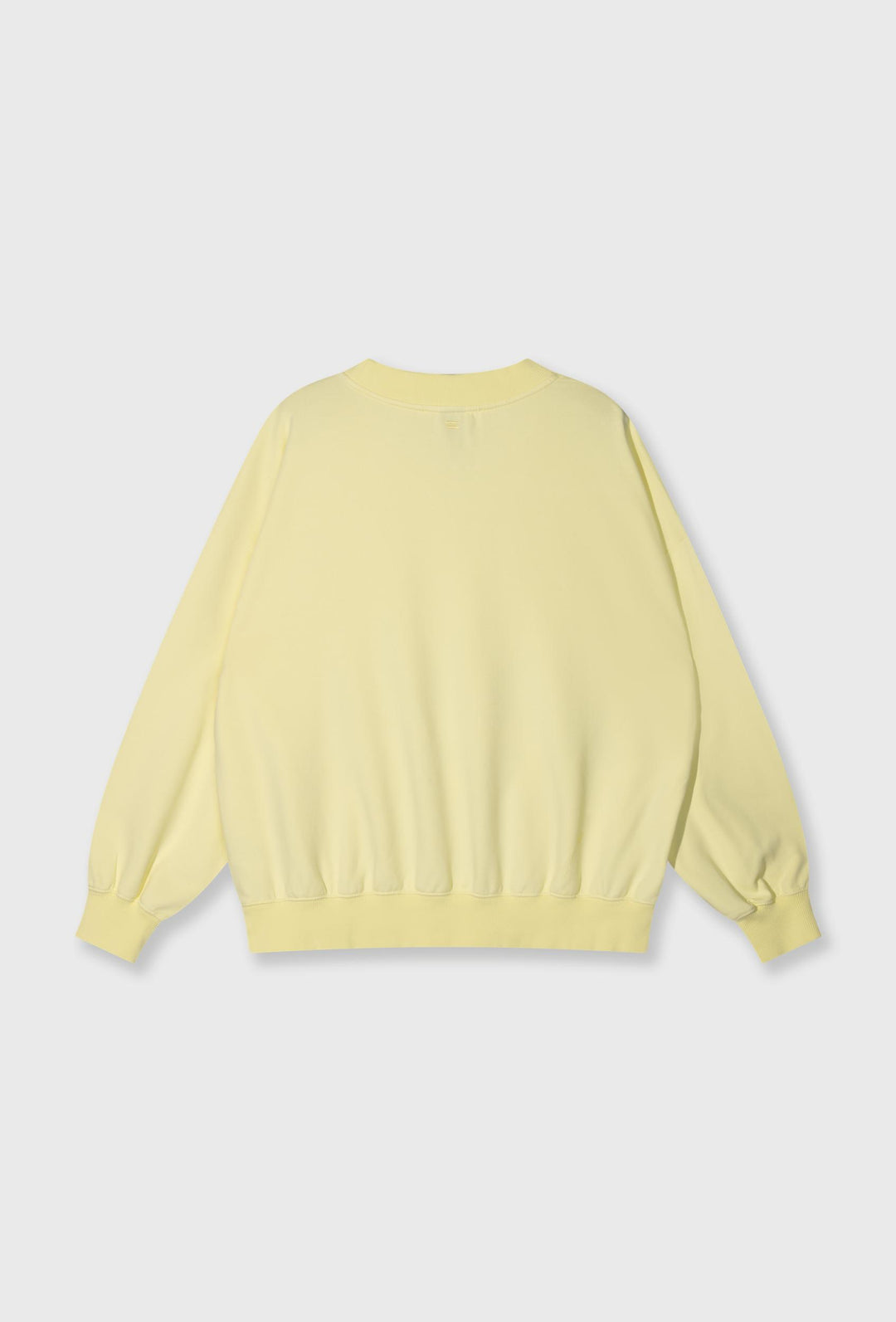Nierozpinana bluza w pastelowym żółtym kolorze