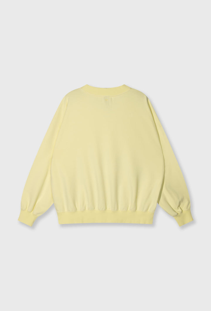 Nierozpinana bluza w pastelowym żółtym kolorze