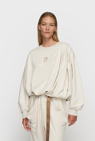 Bluza w kremowym kolorze o luźniejszym fasonie