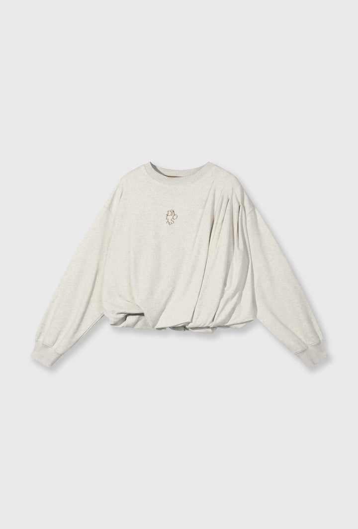 Bluza w kremowym kolorze o luźniejszym fasonie