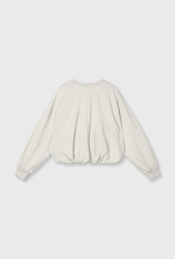 Bluza w kremowym kolorze o luźniejszym fasonie