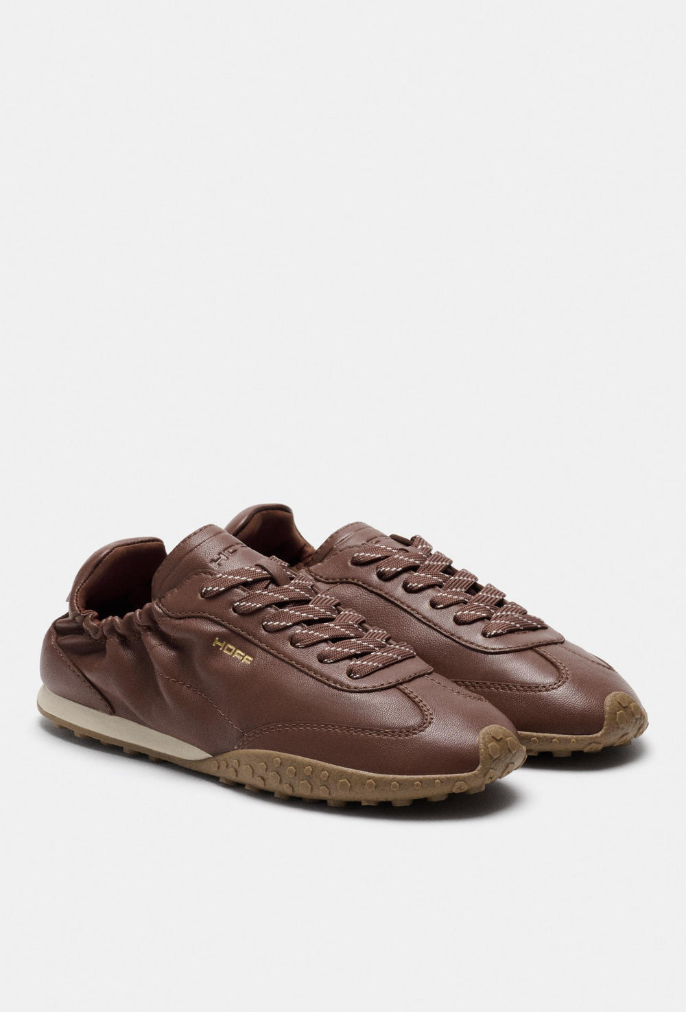 Brązowe skórzane sneakersy z kontrastową podeszwą