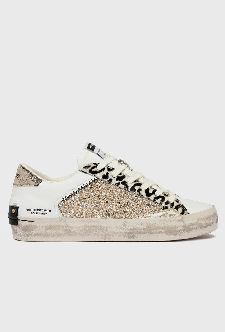 Białe sneakersy Crime London z motywem pantery i brokatem
