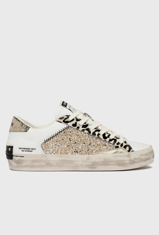 Białe sneakersy Crime London z motywem pantery i brokatem