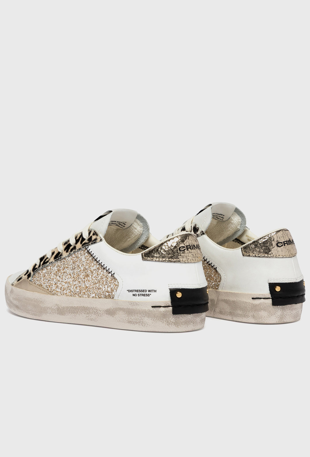 Białe sneakersy Crime London z motywem pantery i brokatem