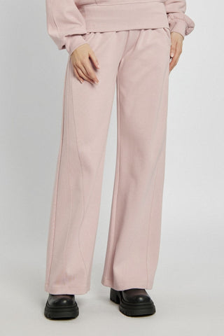 Pudrowe spodnie dresowe z prostą nogawką