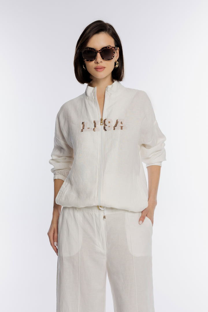 Biały komplet z bluzą i szerokimi lnianymi spodniami