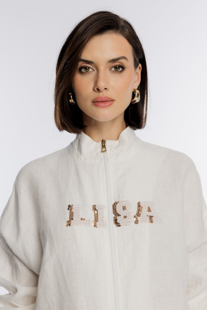 Biała bluza rozpinana ze złotym napisem