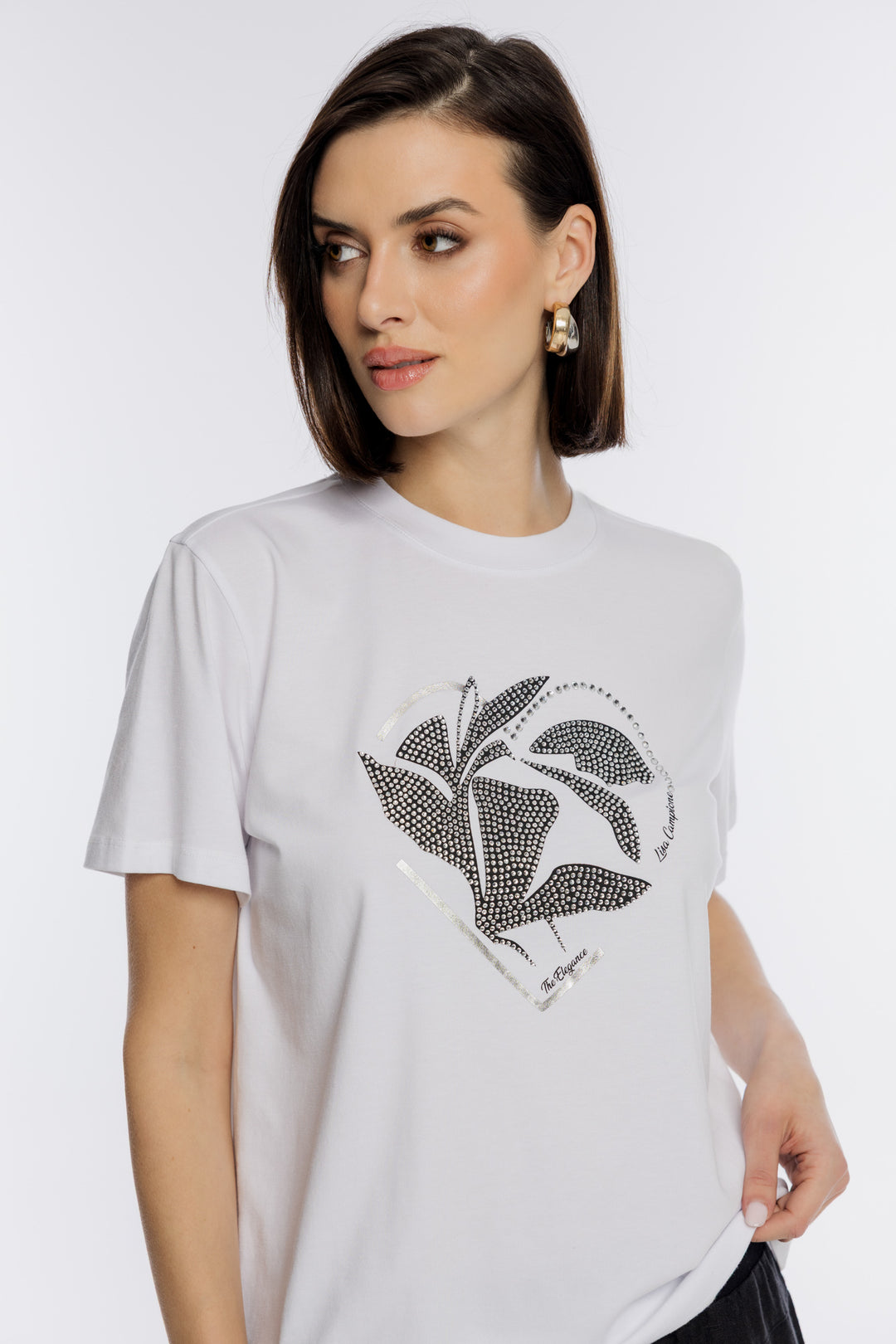 Biały T-shirt z ozdobną aplikacją i motywem liścia