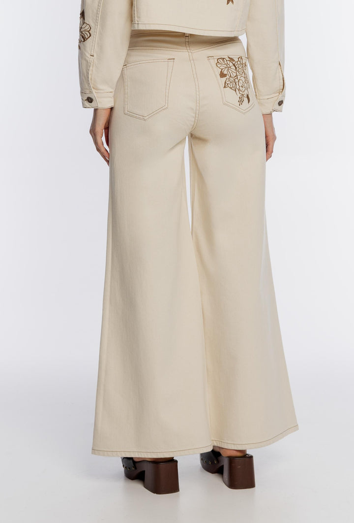 Beżowe spodnie z szeroką nogawką i haftem