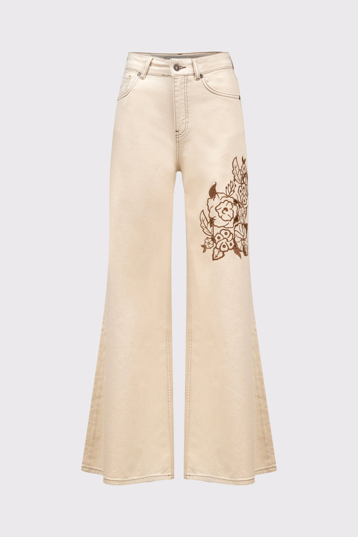 Beżowe spodnie z szeroką nogawką i haftem